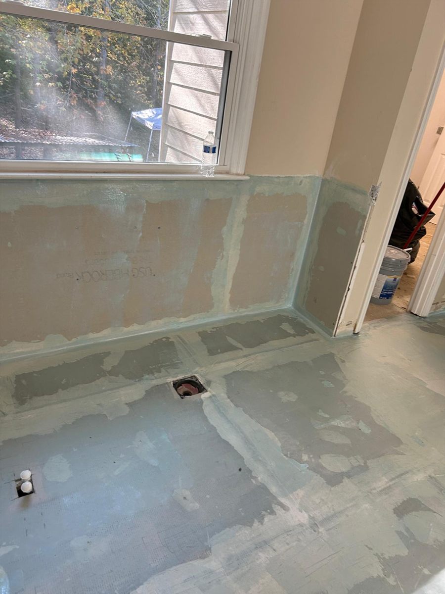 Waterproofing membrane run up the wall below the window