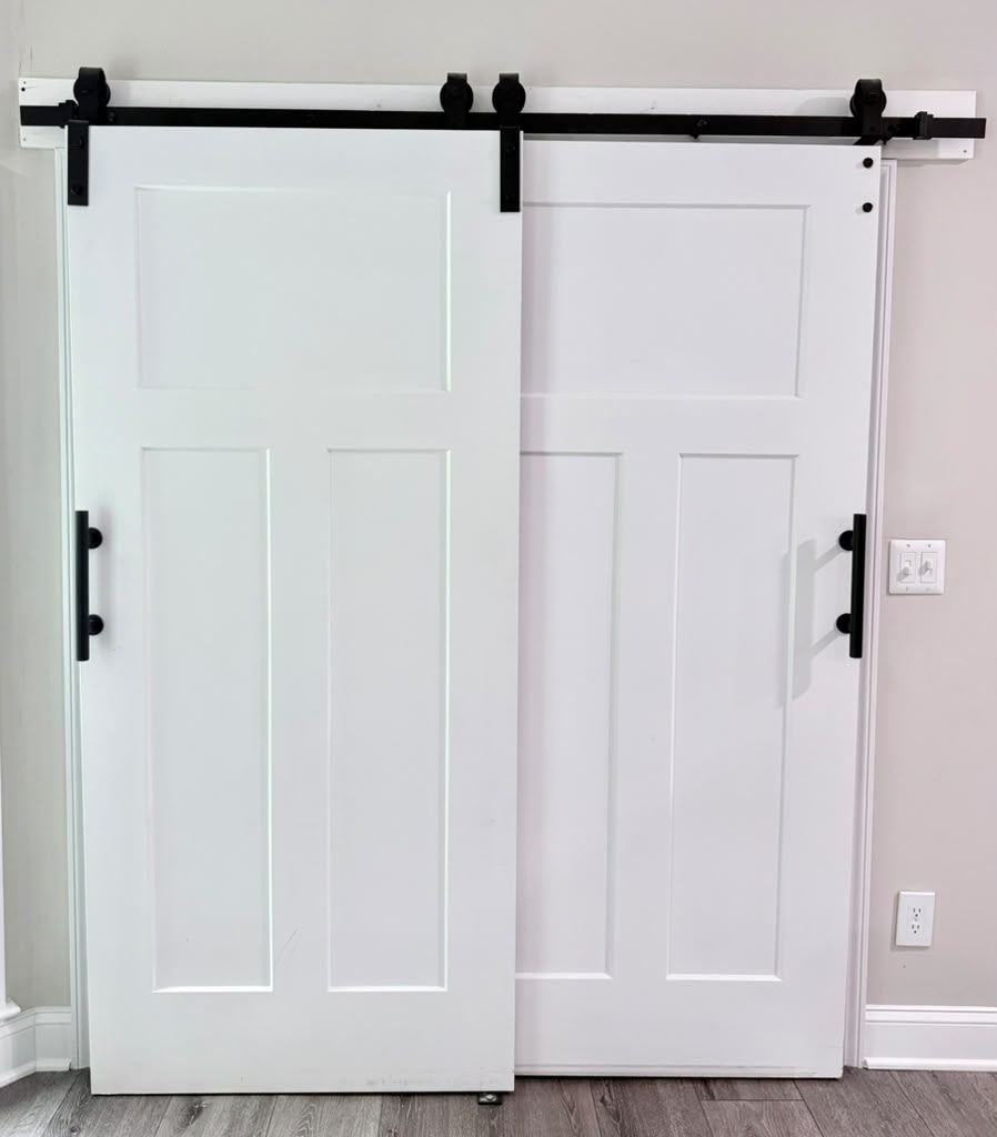 Double sliding barn doors on black track hardware