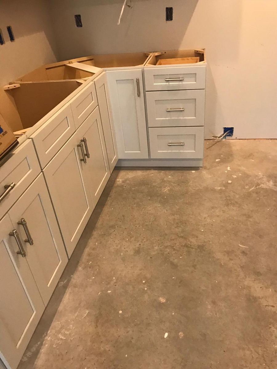 Base cabinets set and levelled, waiting on the countertop template